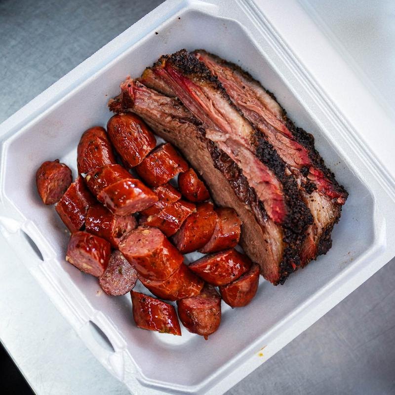 Sliced brisket and sausage from the BBQ pit