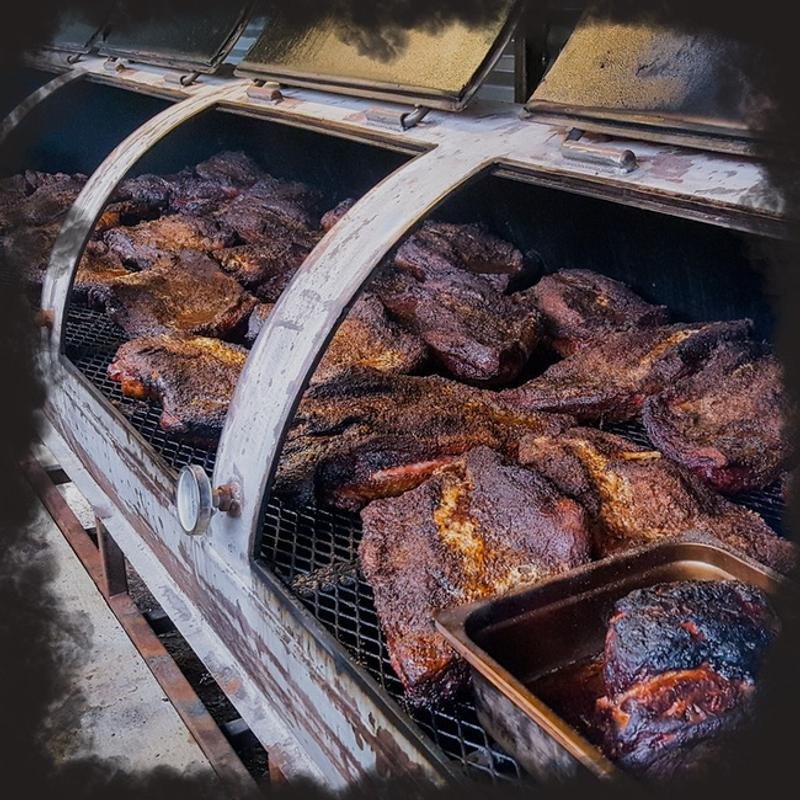 Briskets smoking in the pit